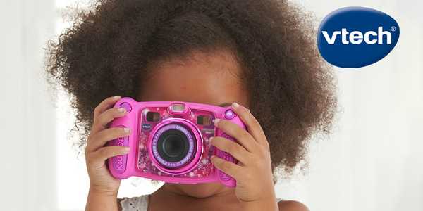 A girl using a pink VTech camera.